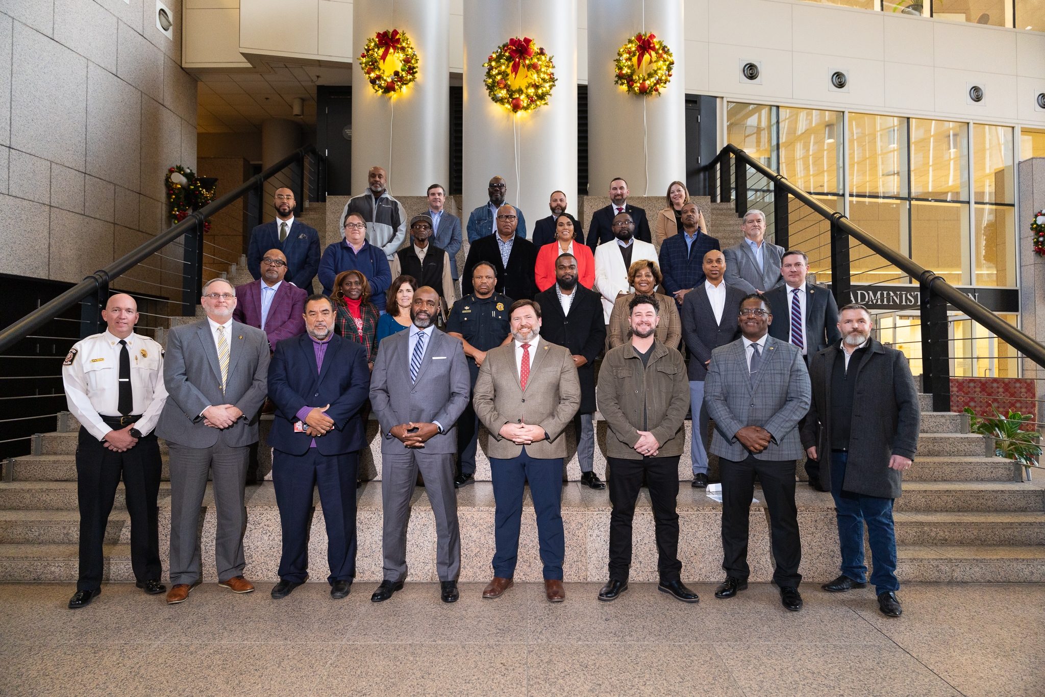 A group photo of the Safer Communities task force at Mobile Government Plaza. 